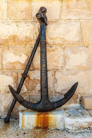 Italy-Apulia-Metropolitan City of Bari-Giovinazzo Old rusted anchor in front of a stone wall Black Ornate Wood Framed Art Print with Double Matting by Wilson, Emily