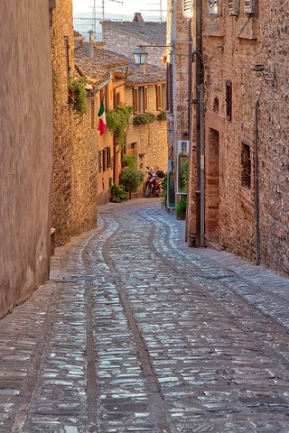 Italy- Umbria. Cobblestone street in the town of Spello. Black Ornate Wood Framed Art Print with Double Matting by Eggers, Julie