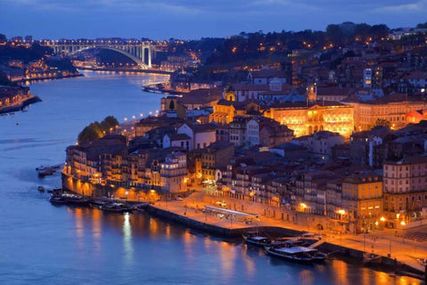 Portugal, Porto Overview of city at night Black Ornate Wood Framed Art Print with Double Matting by Zuckerman, Jim