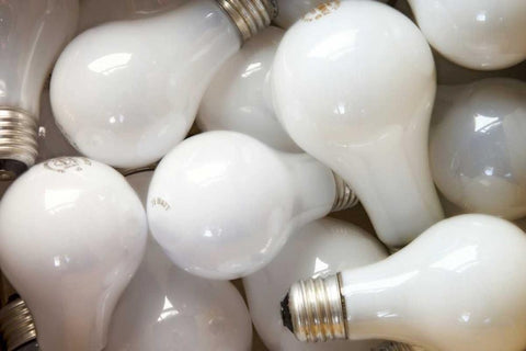 Montage close-up of incandescent light bulbs White Modern Wood Framed Art Print with Double Matting by Paulson, Don