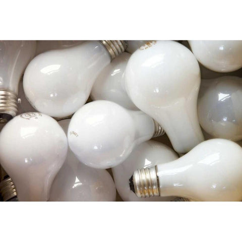 Montage close-up of incandescent light bulbs Black Modern Wood Framed Art Print by Paulson, Don