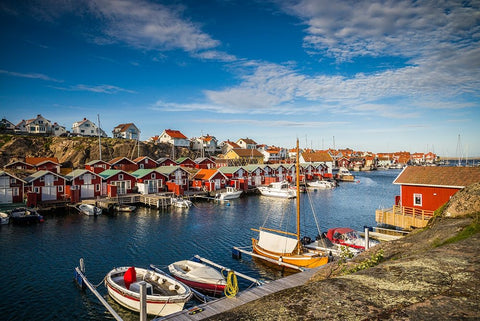 Sweden-Bohuslan-Smogen-Smogenbryggan-antique boat houses and fishing shacks White Modern Wood Framed Art Print with Double Matting by Bibikow, Walter