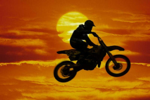 Motocross racer doing jump in front of big sun Black Ornate Wood Framed Art Print with Double Matting by Satushek, Steve