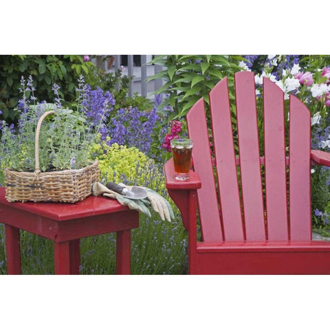 Ice tea rests on red chair while gardening Black Modern Wood Framed Art Print by Paulson, Don