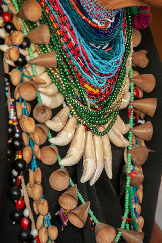 The elaborate regalia of a shaman in the Amazon jungle features jaguar teeth and beads. Black Modern Wood Framed Art Print by Sederquist, Betty