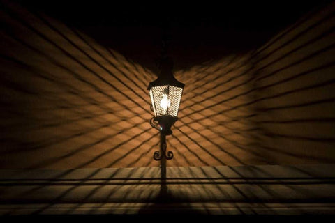 Mexico Wire cage lamp at night creates shadows Black Ornate Wood Framed Art Print with Double Matting by Young, Bill