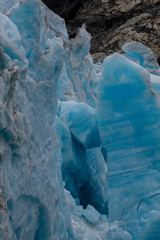 Ice glows brilliant blue at the terminus of Margerie Glacier. Black Modern Wood Framed Art Print by Sederquist, Betty