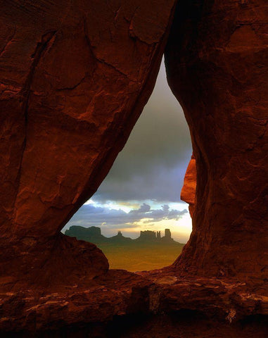 Teardrop arch frames the Monument Valley rock formations on the Utah-Arizona border Black Ornate Wood Framed Art Print with Double Matting by SMO