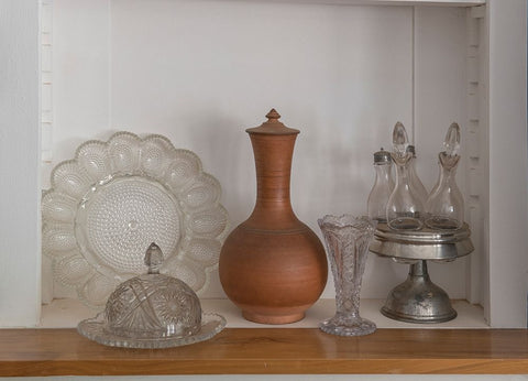 Old glass and serving ware in a ghost town. Black Modern Wood Framed Art Print by Sederquist, Betty
