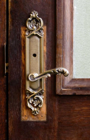 USA, Maine Ornate handle on wooden door Black Ornate Wood Framed Art Print with Double Matting by Clemons, Kathleen