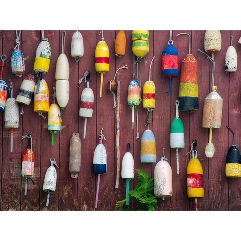 Maine Colorful buoys hanging on the exterior of a building Black Modern Wood Framed Art Print by Eggers, Julie
