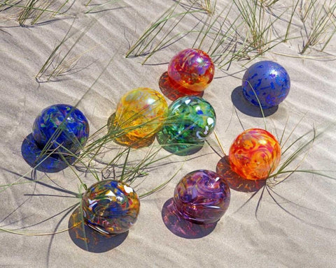 USA, Oregon Colorful glass floats on sand dune Black Ornate Wood Framed Art Print with Double Matting by Terrill, Steve