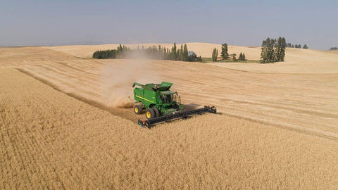 Aerial view of a John Deere combine cutting wheat on a sunny afternoon-Spokane County White Modern Wood Framed Art Print with Double Matting by Probst, Greg