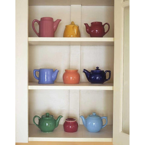 Antique ceramic teapots and sugar bowls in cupboard White Modern Wood Framed Art Print by Terrill, Steve