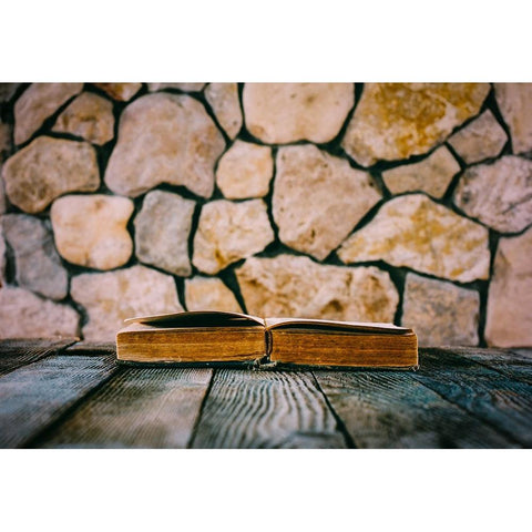 Old Open Book On Old Wooden Table On A Background Of Stone Walls Black Modern Wood Framed Art Print by Solovie, Andre