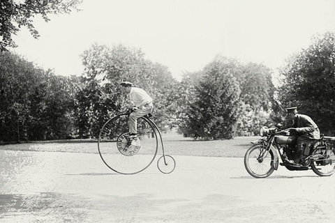 Motorcycle cop chases a Penny Farthing Velocipede Black Ornate Wood Framed Art Print with Double Matting by Unknown