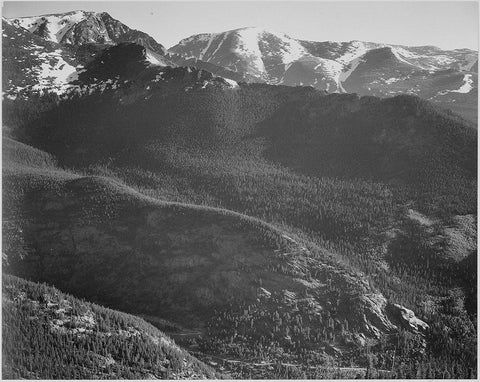 View of wooded hills with mountains in background, in Rocky Mountain National Park, Colorado, ca. 19 White Modern Wood Framed Art Print with Double Matting by Adams, Ansel