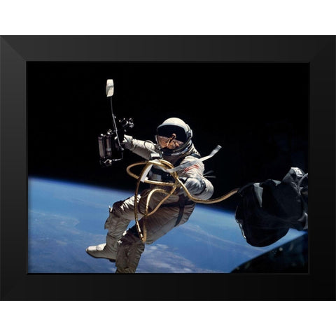 Astronaut Edward White during first EVA performed during Gemini 4 flight Black Modern Wood Framed Art Print by NASA