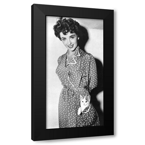 Elizabeth Taylor with a kitten in her pocket Black Modern Wood Framed Art Print with Double Matting by Hollywood Photo Archive