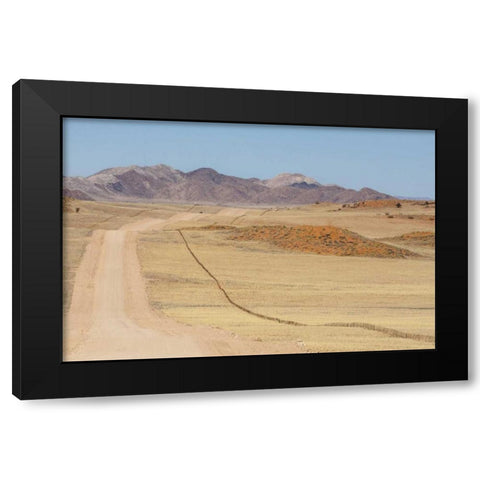 Namibia, Namib Desert Road and fence in desert Black Modern Wood Framed Art Print by Kaveney, Wendy