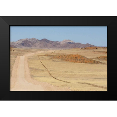 Namibia, Namib Desert Road and fence in desert Black Modern Wood Framed Art Print by Kaveney, Wendy