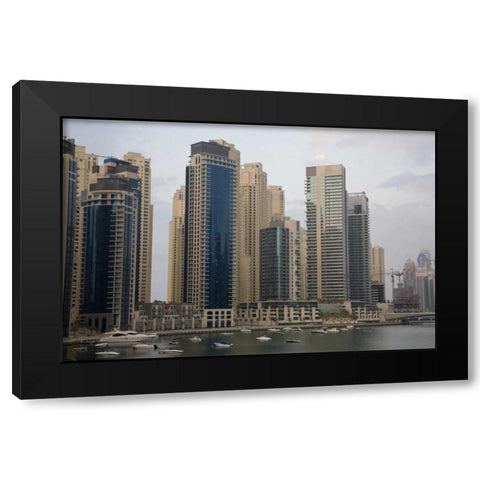 UAE, Dubai Modern buildings tower over boats Black Modern Wood Framed Art Print with Double Matting by Young, Bill