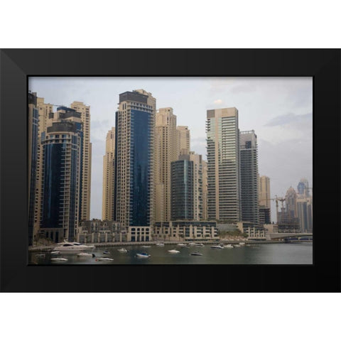 UAE, Dubai Modern buildings tower over boats Black Modern Wood Framed Art Print by Young, Bill