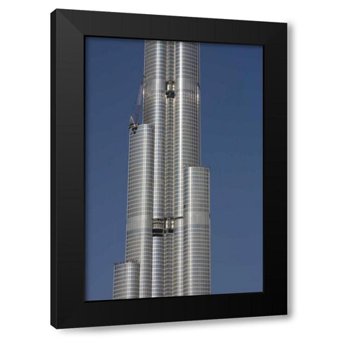 UAE, Dubai Tall skyscraper under construction Black Modern Wood Framed Art Print with Double Matting by Young, Bill