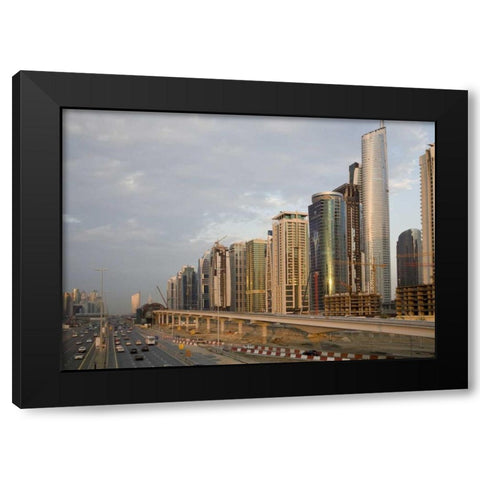 UAE, Dubai Jumeirah Lake Towers beside a Road Black Modern Wood Framed Art Print with Double Matting by Young, Bill