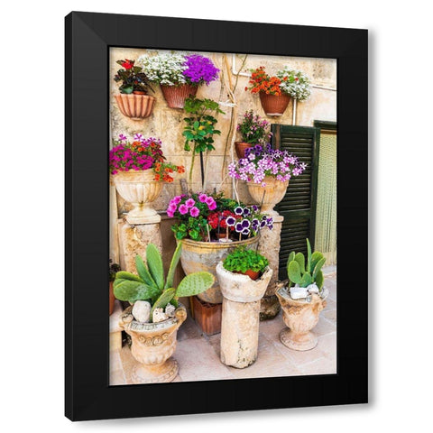 Italy-Apulia-Metropolitan City of Bari-Monopoli Flowers in planters outside a stone building Black Modern Wood Framed Art Print by Wilson, Emily