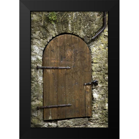 Estonia, Tallinn Old wooden door in stone wall Black Modern Wood Framed Art Print by Ross, Nancy ,  Steve
