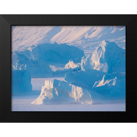 Icebergs frozen into the sea ice of the Uummannaq Fjord System during winter  Black Modern Wood Framed Art Print by Zwick, Martin