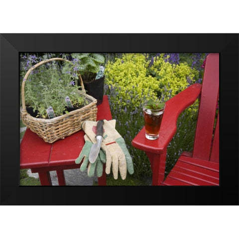 Ice tea rests on red chair while gardening Black Modern Wood Framed Art Print by Paulson, Don