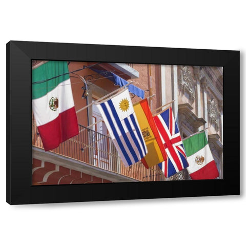 Mexico, Guanajuato Flags displayed from balcony Black Modern Wood Framed Art Print by Paulson, Don