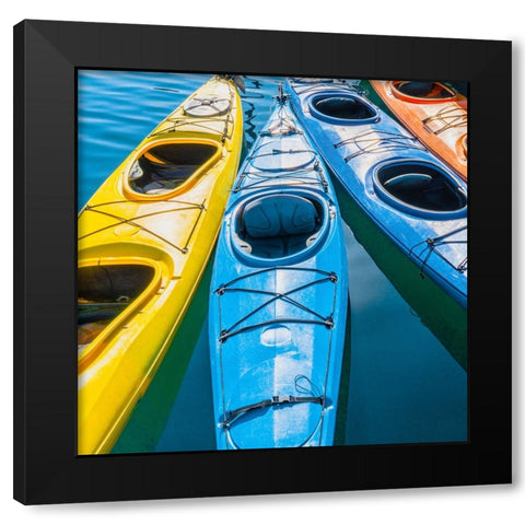 Four colorful kayaks positioned in an array. Black Modern Wood Framed Art Print with Double Matting by Muir, Janet