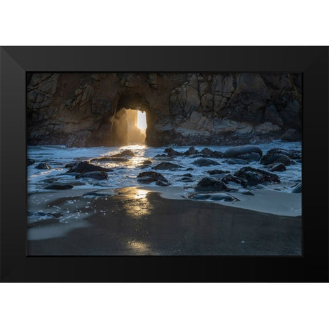 Sun shines through a tunnel in a sea cliff in the Big Sur area. Black Modern Wood Framed Art Print by Sederquist, Betty