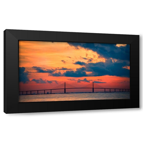 The Skyway Bridge over the Gulf of Mexico with the reds and oranges of the sunrise in the sky Black Modern Wood Framed Art Print with Double Matting by Haddad, Sheila