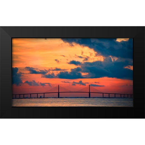 The Skyway Bridge over the Gulf of Mexico with the reds and oranges of the sunrise in the sky Black Modern Wood Framed Art Print by Haddad, Sheila