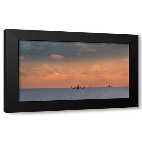 Fishing boats deep out to sea against the backdrop of dramatic sunset clouds and sky Black Modern Wood Framed Art Print by Haddad, Sheila