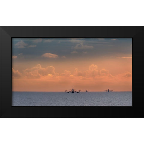 Fishing boats deep out to sea against the backdrop of dramatic sunset clouds and sky Black Modern Wood Framed Art Print by Haddad, Sheila