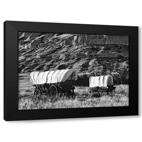 Nebraska, Scotts Bluff Covered wagons in field Black Modern Wood Framed Art Print by Flaherty, Dennis