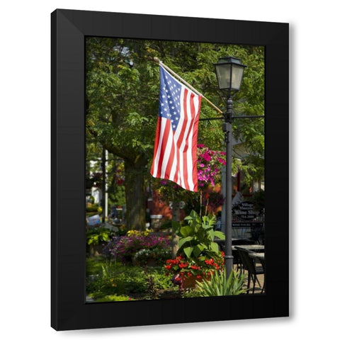 NY, Lewiston American flag attached to lamp post Black Modern Wood Framed Art Print by Lord, Fred