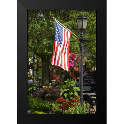 NY, Lewiston American flag attached to lamp post Black Modern Wood Framed Art Print by Lord, Fred