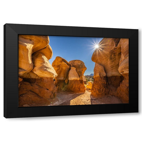 USA- Utah- Devils Garden Outstanding Natural Area. Sun starburst on hoodoo rock formations. Black Modern Wood Framed Art Print by Jaynes Gallery
