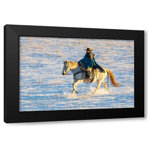 USA- Shell- Wyoming. Hideout Ranch cowgirl riding her horse in the snow.  Black Modern Wood Framed Art Print by Gulin, Darrell