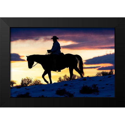 USA- Shell- Wyoming. Hideout Ranch cowboy on horseback silhouetted at sunset.  Black Modern Wood Framed Art Print by Gulin, Darrell