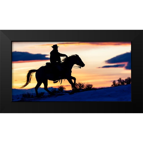 USA- Shell- Wyoming. Hideout Ranch cowgirl silhouetted on horseback at sunset.  Black Modern Wood Framed Art Print by Gulin, Darrell