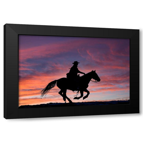 USA- Shell- Wyoming. Hideout Ranch cowgirl silhouetted on horseback at sunset.  Black Modern Wood Framed Art Print with Double Matting by Gulin, Darrell