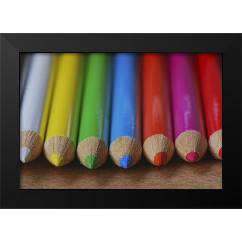 Row of multicolored colored pencils lay on table Black Modern Wood Framed Art Print by Terrill, Steve