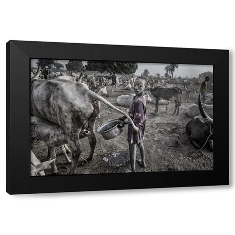 Mundari Child Filling The Container With Cow Urine - South Sudan Black Modern Wood Framed Art Print with Double Matting by Inazio Kuesta, Joxe